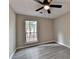 This bedroom has modern floors and a large window that provides lots of natural light at 396 Independence Dr, Jonesboro, GA 30238
