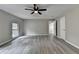 This bedroom provides a ceiling fan, window for light, and attractive wood-look flooring at 396 Independence Dr, Jonesboro, GA 30238