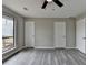 Spacious bonus room with hardwood floors, multiple doors, and a bright window at 396 Independence Dr, Jonesboro, GA 30238