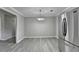 An open dining area with gray walls, modern light fixture and stainless steel refrigerator at 396 Independence Dr, Jonesboro, GA 30238