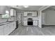 Bright kitchen features modern appliances, granite countertops, white cabinets and subway tile backsplash at 396 Independence Dr, Jonesboro, GA 30238