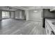 Open concept living space featuring hardwood floors, a large window and neutral gray paint at 396 Independence Dr, Jonesboro, GA 30238