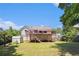 Exterior of home showing back deck, lush yard, mature trees, and blue sky at 6195 Queensdale Dr, Douglasville, GA 30135