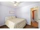 This bedroom boasts an open doorway and closet view at 6195 Queensdale Dr, Douglasville, GA 30135