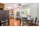 Cozy dining area features a table setting, a stainless steel refrigerator, and ample natural light at 6195 Queensdale Dr, Douglasville, GA 30135