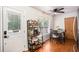 Cozy dining nook with a table for four, a modern shelving unit, and a view to the backyard at 6195 Queensdale Dr, Douglasville, GA 30135
