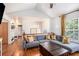 Inviting living room with vaulted ceilings, hardwood flooring, comfortable seating, and natural light at 6195 Queensdale Dr, Douglasville, GA 30135