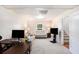 Spacious living area with carpeting, providing a comfortable and relaxing atmosphere at 6195 Queensdale Dr, Douglasville, GA 30135