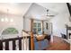 Bright living room boasting a vaulted ceiling, hardwood floors, and a large arched window at 6195 Queensdale Dr, Douglasville, GA 30135