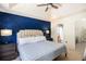 Beautiful main bedroom features a tray ceiling, accent wall, and an ensuite bathroom and walk-in closet at 6195 Queensdale Dr, Douglasville, GA 30135