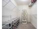 Spacious walk-in closet provides ample storage space with organized shelving and hanging rods at 6195 Queensdale Dr, Douglasville, GA 30135