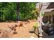 Spacious backyard with natural landscaping, mature trees, and a relaxing patio area at 2470 Anderson Estates Ct, Marietta, GA 30064