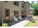 Charming home exterior featuring a patio with outdoor seating, landscaping, and natural light at 2470 Anderson Estates Ct, Marietta, GA 30064
