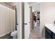 Bathroom with toilet, shower, and doorway view of the walk-in closet at 2470 Anderson Estates Ct, Marietta, GA 30064