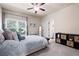 Comfortable bedroom featuring a ceiling fan, natural light, and neutral décor at 2470 Anderson Estates Ct, Marietta, GA 30064