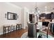 Dining area with a decorative mirror and seating, views to the Kitchen with dark cabinets at 2470 Anderson Estates Ct, Marietta, GA 30064
