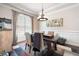 Cozy dining room featuring a tray ceiling, contemporary chandelier, and stylish decor at 2470 Anderson Estates Ct, Marietta, GA 30064
