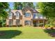 Stunning two-story brick home featuring a well-manicured lawn and a welcoming front porch at 2470 Anderson Estates Ct, Marietta, GA 30064