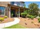 Welcoming front porch with stone accents, elegant pillars, and a manicured garden bed at 2470 Anderson Estates Ct, Marietta, GA 30064