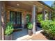 Welcoming front porch features stone pillars, double doors, potted plants, and outdoor seating at 2470 Anderson Estates Ct, Marietta, GA 30064