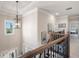 Open hallway featuring crown molding and wood banister with iron spindles at 2470 Anderson Estates Ct, Marietta, GA 30064
