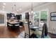 Charming eat-in kitchen featuring dark cabinets, granite countertops and pendant lighting at 2470 Anderson Estates Ct, Marietta, GA 30064