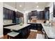 Well-equipped kitchen with granite countertops, a central island, and dark wood cabinetry at 2470 Anderson Estates Ct, Marietta, GA 30064