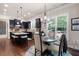 Kitchen eating area with a round table and chairs, with a view to the lush backyard at 2470 Anderson Estates Ct, Marietta, GA 30064