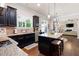 Open concept kitchen with stainless steel appliances, granite countertops, an island, and hardwood flooring at 2470 Anderson Estates Ct, Marietta, GA 30064