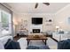 Inviting living room with a fireplace, TV, and neutral decor, and large window at 2470 Anderson Estates Ct, Marietta, GA 30064