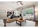Open-concept living room with views to the kitchen and large windows overlooking the backyard at 2470 Anderson Estates Ct, Marietta, GA 30064
