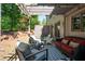 Inviting patio with comfortable seating, a pergola, and lush green surroundings at 2470 Anderson Estates Ct, Marietta, GA 30064