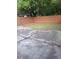 The backyard has a wood fence, grass and a cracked concrete patio at 3530 Hopkins Ct, Powder Springs, GA 30127