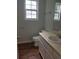 Bathroom with wood floors and neutral paint at 3530 Hopkins Ct, Powder Springs, GA 30127