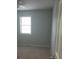 This bedroom has a ceiling fan and a window for ample natural light at 3530 Hopkins Ct, Powder Springs, GA 30127