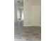 Hallway with hardwood floors and neutral paint colors leading to other rooms at 3530 Hopkins Ct, Powder Springs, GA 30127