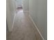 Neutral hallway with beige carpet at 3530 Hopkins Ct, Powder Springs, GA 30127