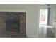 Cozy living room featuring a stone fireplace and sliding glass doors to the back at 3530 Hopkins Ct, Powder Springs, GA 30127