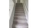 Staircase with carpet at 3530 Hopkins Ct, Powder Springs, GA 30127