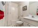 Cozy bathroom with shower-tub combo, single sink vanity, and decorative accents at 4378 Chestnut Oaks Trce, Lithonia, GA 30038