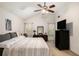 Bright bedroom featuring a large bed, ceiling fan, and neutral decor at 4378 Chestnut Oaks Trce, Lithonia, GA 30038