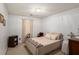 Cozy bedroom featuring a neutral color scheme, a large bed, and natural light at 4378 Chestnut Oaks Trce, Lithonia, GA 30038