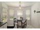 Cozy breakfast nook with lots of natural light and modern table set at 4378 Chestnut Oaks Trce, Lithonia, GA 30038