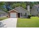 Charming single-story home with well-maintained lawn and attached one-car garage at 4378 Chestnut Oaks Trce, Lithonia, GA 30038