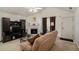 Bright living room features a fireplace, vaulted ceilings, and modern decor at 4378 Chestnut Oaks Trce, Lithonia, GA 30038