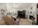 Bright living room features a fireplace, vaulted ceilings, and modern decor at 4378 Chestnut Oaks Trce, Lithonia, GA 30038