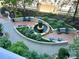 Beautiful courtyard with a fountain, seating, and landscaping at 855 Peachtree Ne St # 1406, Atlanta, GA 30308