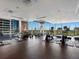 Well-equipped fitness center with treadmills, stationary bikes, and free weights with large windows at 855 Peachtree Ne St # 1406, Atlanta, GA 30308