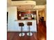Kitchen showcasing granite countertop bar and seating overlooking the kitchen and stainless appliances at 855 Peachtree Ne St # 1406, Atlanta, GA 30308