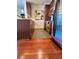 Kitchen featuring stainless steel appliances, wood cabinets, granite countertops, and wood flooring at 855 Peachtree Ne St # 1406, Atlanta, GA 30308